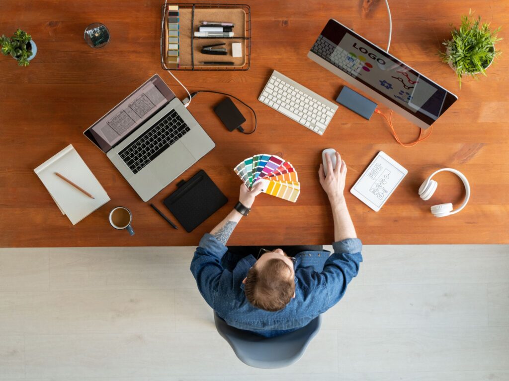 A designer carefully planning a business' brand identity and visuals