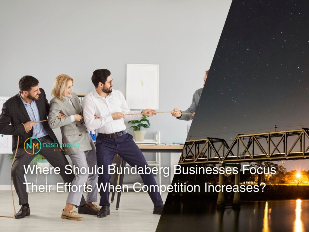 Business team discussing strategy with Bundaberg city skyline in the background.