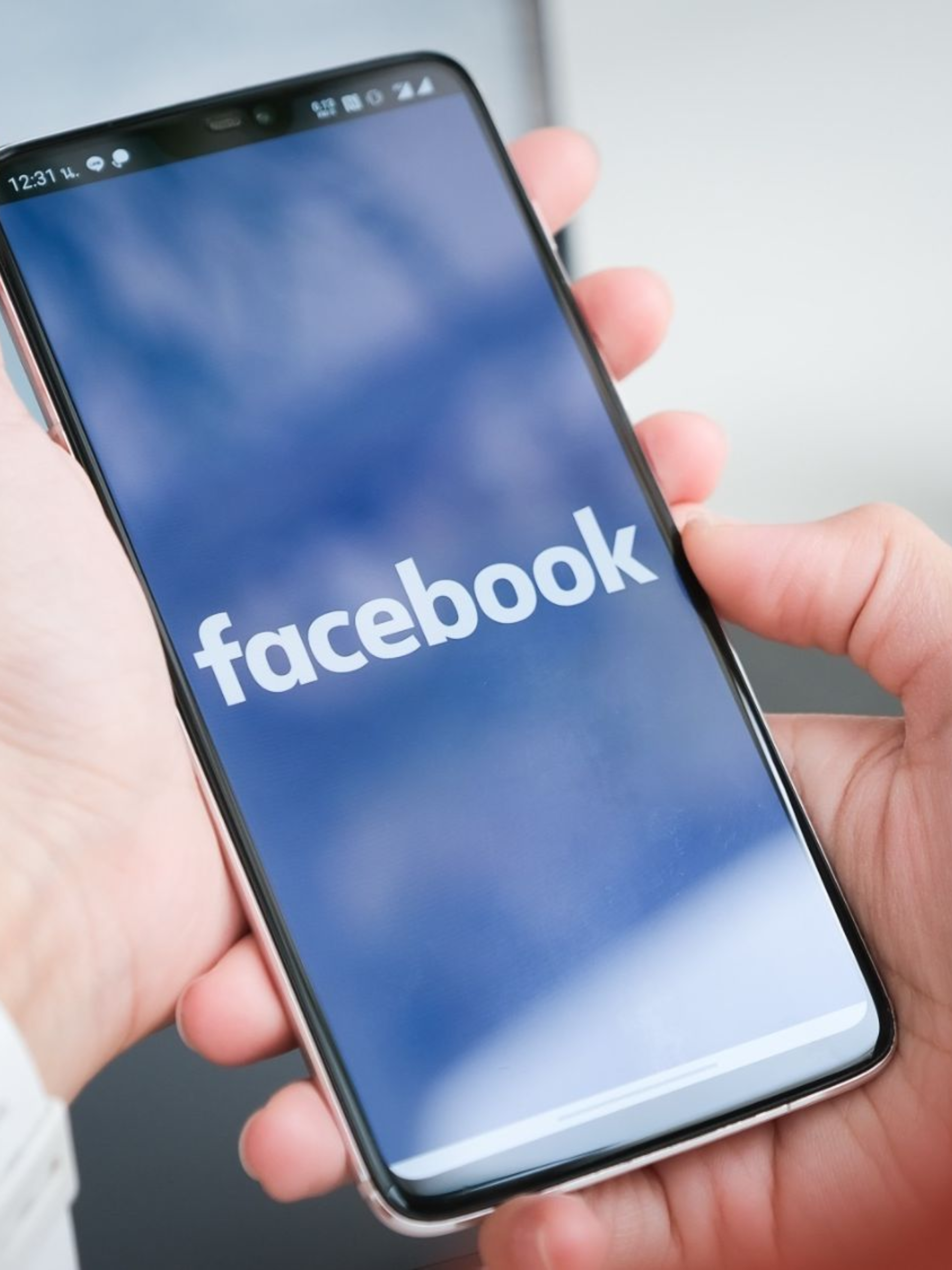 Smartphone displaying Facebook app representing social media advertising and audience engagement