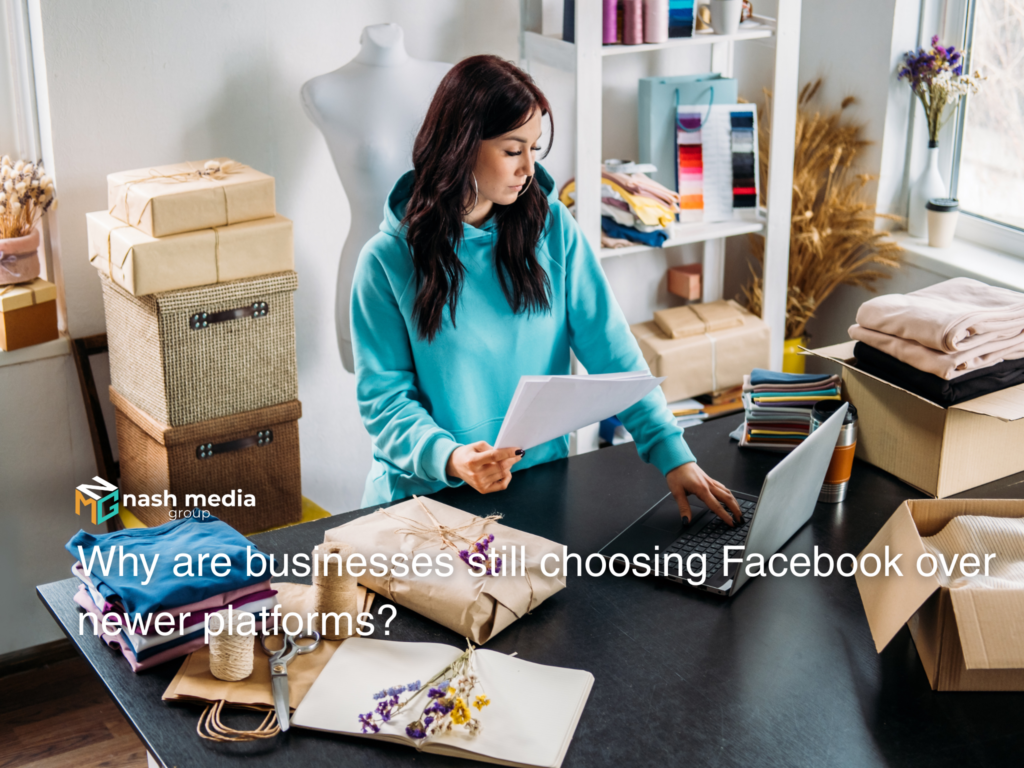 Woman reviewing packages in a small business while checking social media marketing plans