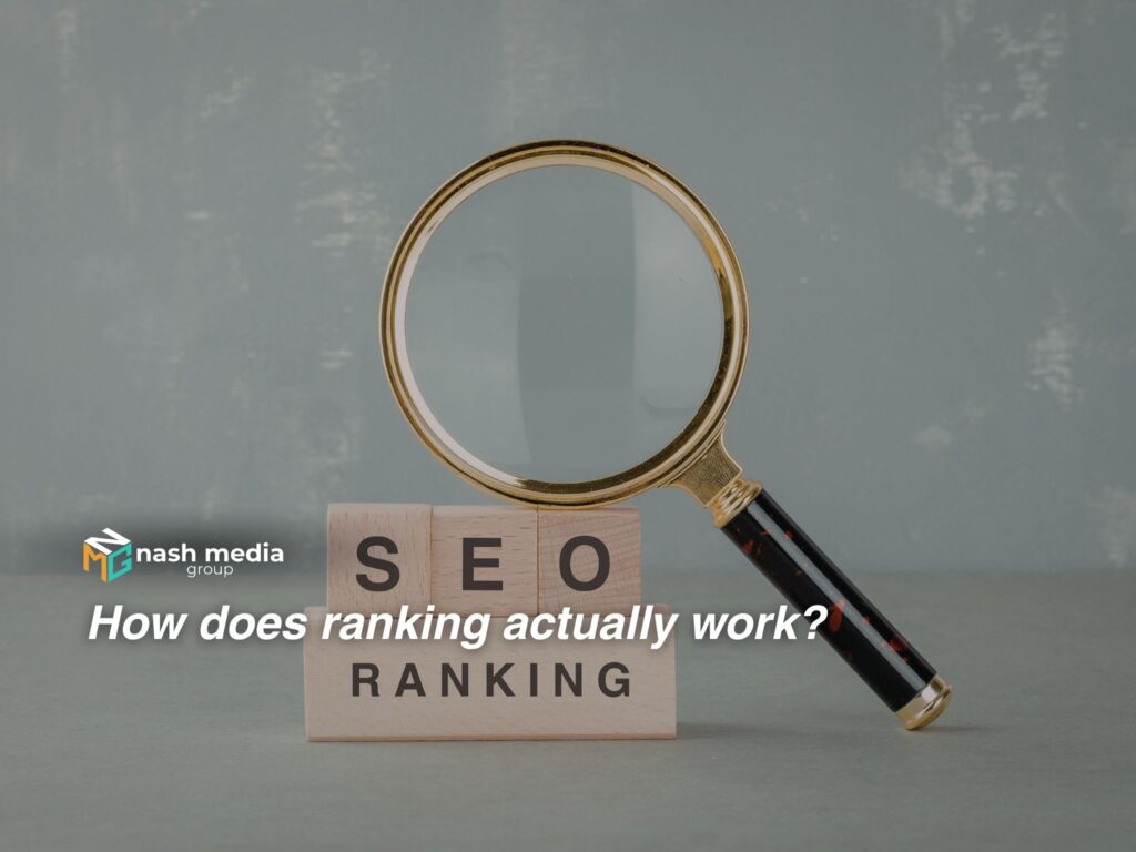 A magnifying glass on top of a stacked blocks with "SEO ranking" written on them.