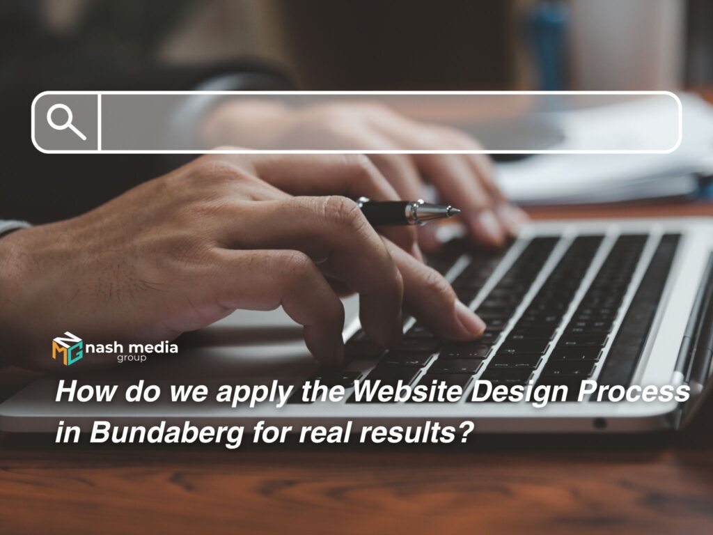 A website developer working with a laptop.